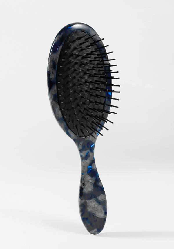Paddelbürste für Toupet oder Haarsysteme mit gepolstertem Boden